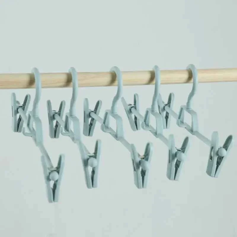 Cintre pour étendoir à linge avec pinces réglables