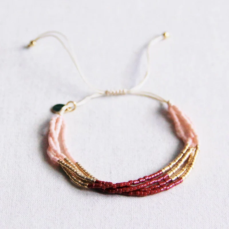 BRACELET EN PERLES - bordeaux/lnude/doré