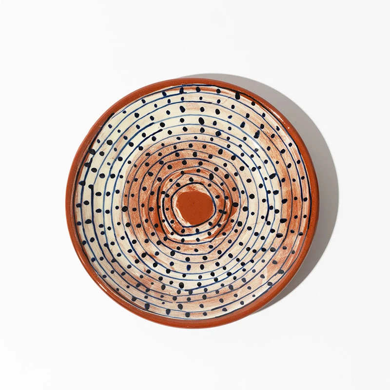 Assiette peinte en céramique