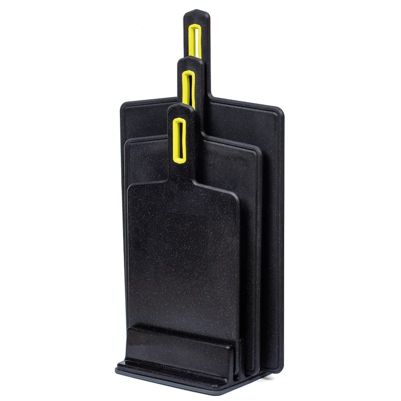 Practic cutting board set, featuring three sizes, ensures versatility for food prep tasks. Crafted in sleek black Vegana, these boards are both durable and stylish, ideal for any kitchen.