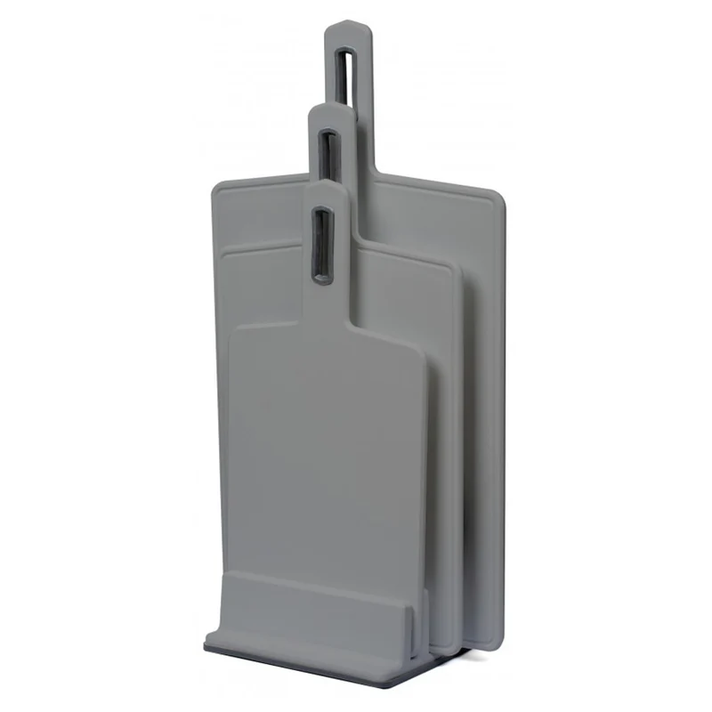 Practic cutting board set offers versatility and convenience with three different sizes for various food prep tasks. Made in grey Vegana, these boards are durable and stylish, perfect for any kitchen.